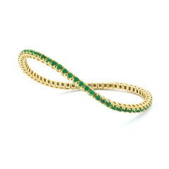 Bracelet tennis élastique à facettes avec émeraude en or jaune 750/18 carats